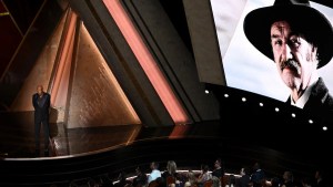 An image of the late Gene Hackman as Morgan Freeman stands onstage during the 97th Annual Academy Awards. (Credit: Patrick T. Fallon/AFP via Getty Images)