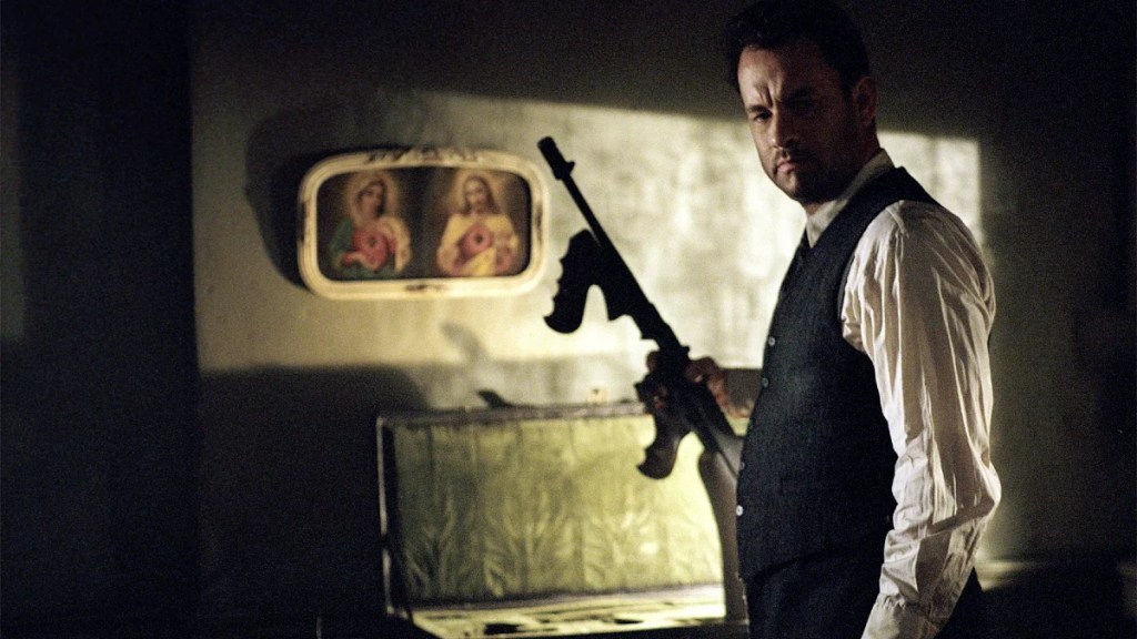 Tom Hanks holds a tommy gun in "Road to Perdition."
