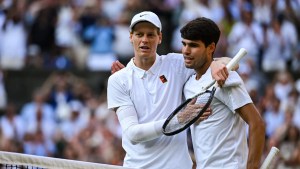 Two men stand on the tennis court at Wimbledon